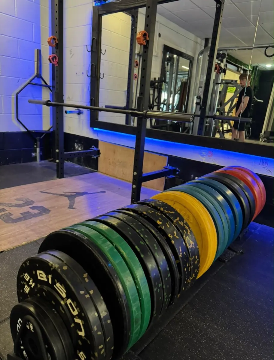 Colourful bumper plates by the lifting platform at Feel Good Studio Gym, Louth